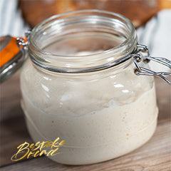 Four creative sourdough starter discard recipes including pancakes, pizza crust, scones, and cinnamon buns