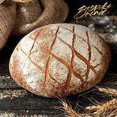 Five misconceptions about sourdough bread with a rustic loaf on a wooden board