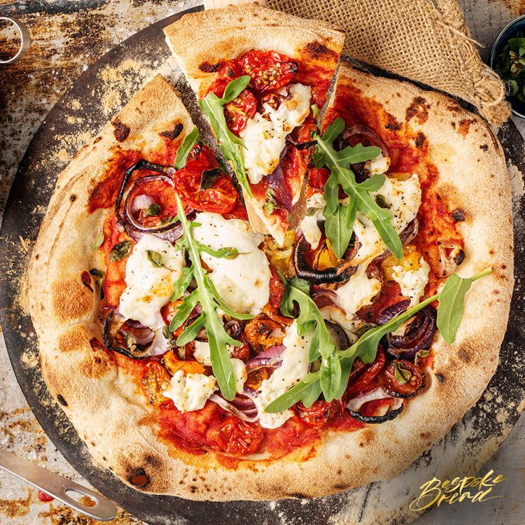 Couple enjoying pizza making classes together in a cozy kitchen