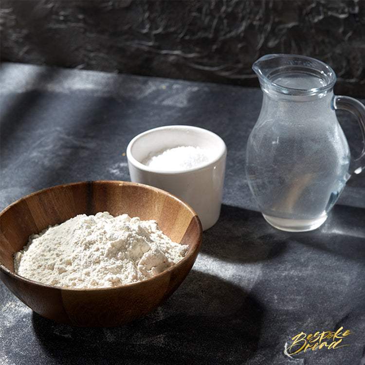 Female pastry chef preparing bread dough in a hands-on bread making class