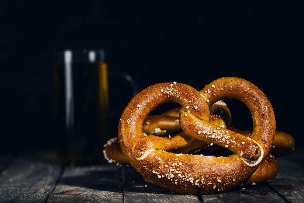 Glossy traditional pretzel with coarse salt and a boiled bagel showcasing their unique textures