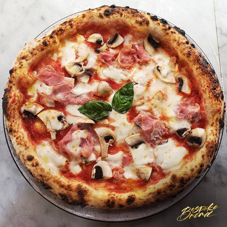 Close-up of hands gently kneading artisanal sourdough pizza dough