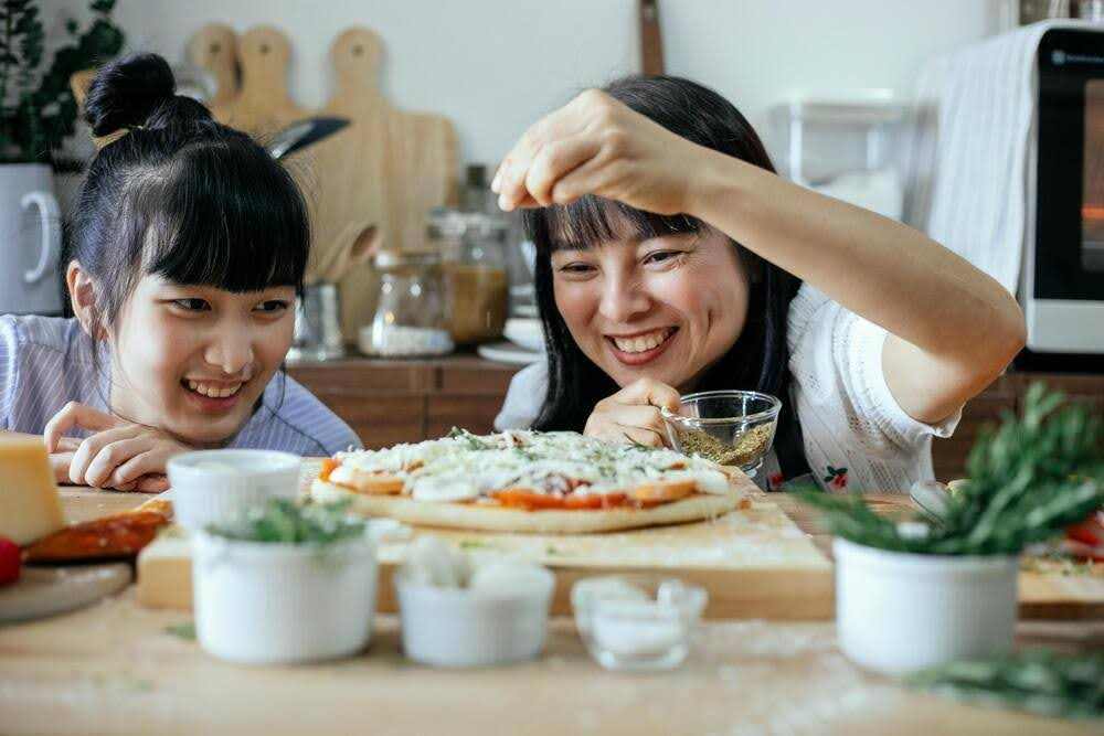 Family baking classes with multiple generations enjoying baking together in a kitchen