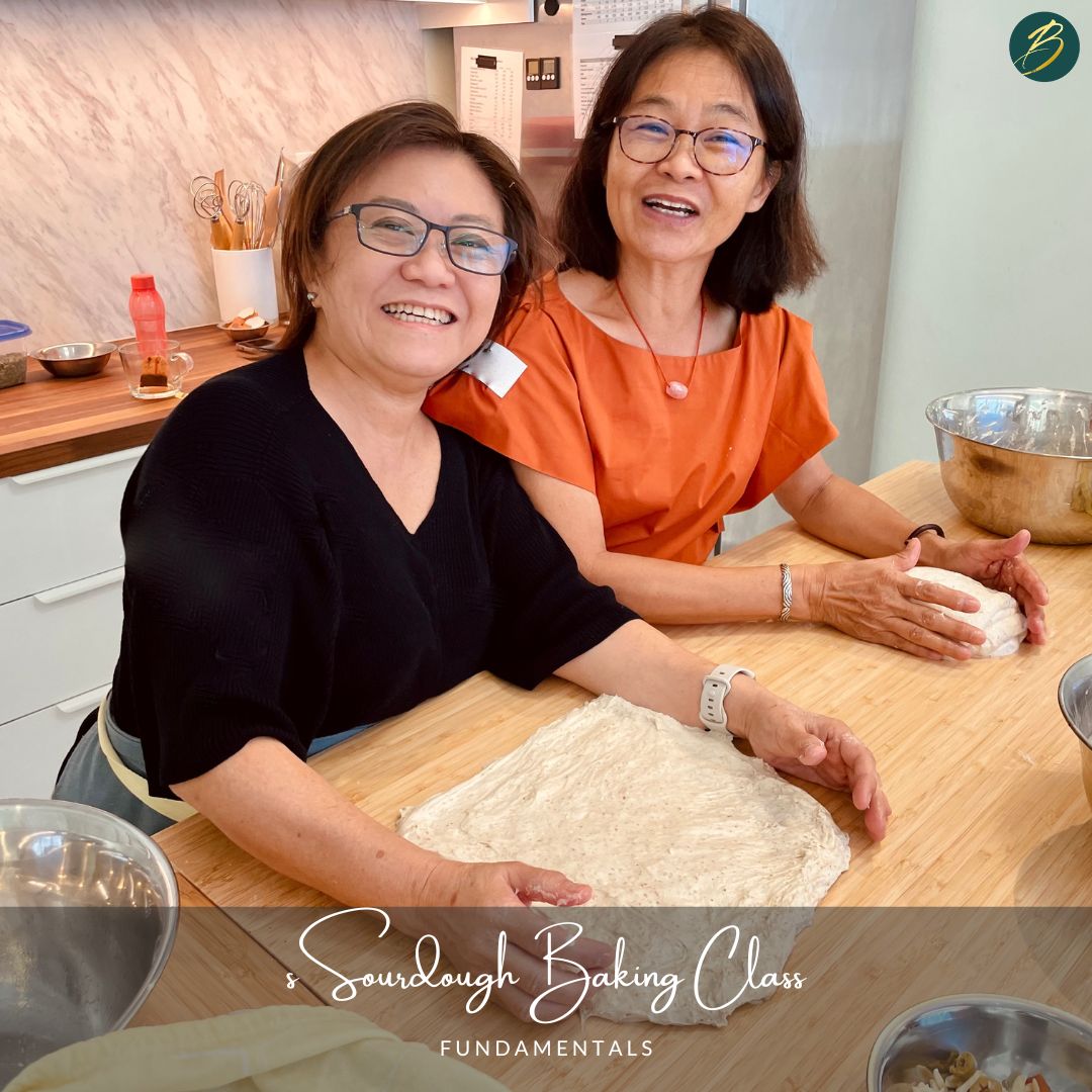 two women preparing sourdough bread
