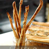 Assorted sourdough banana bread loaves and breadsticks from baking class