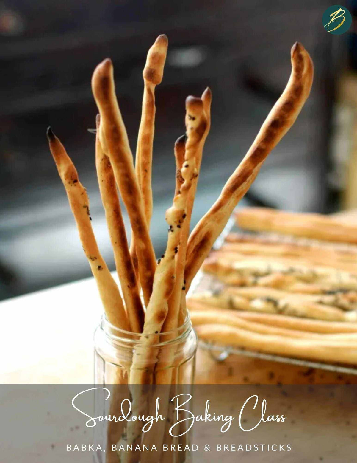 Assorted sourdough banana bread loaves and breadsticks from baking class